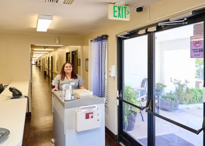 An employee with a cart at Arbor Place Residential